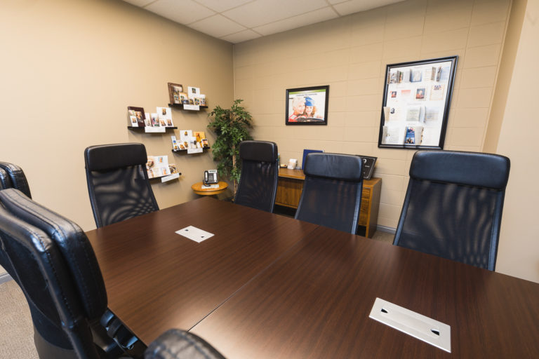 Funeral planning room at Olivers Funeral Home. A Large table with chairs