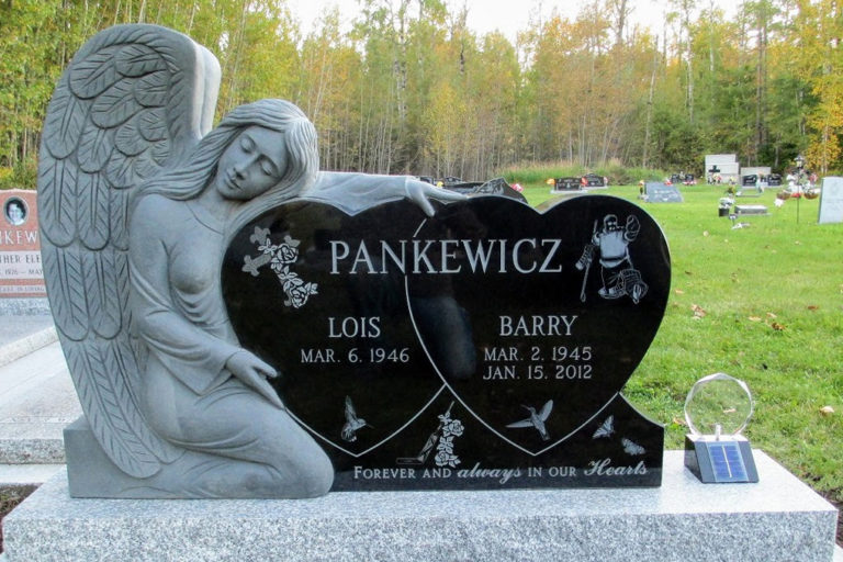 Angel Pankewicz, two large heart monuments with a very large angel hugging the monument.Gravestone marker at the cemetery with a large angel beside the marker. The headstone is two hearts with each loved one in their own heart. There is a goalie, a cross, doves, a goalie stick and the etching that says Forever and always in our hearts.