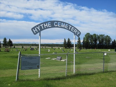 Hythe Cemetery sign with the cemetery in the background