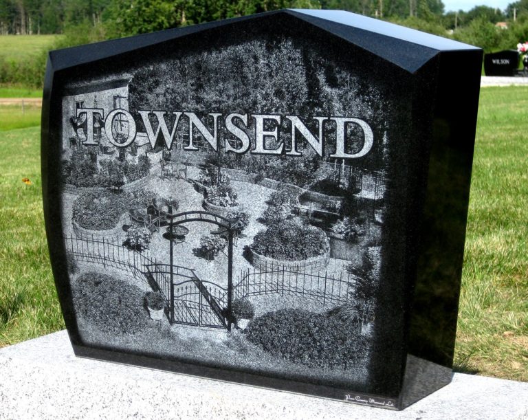 Granite Monument with a garden scene sandblasted onto the back with the last name Townsend in white writing.