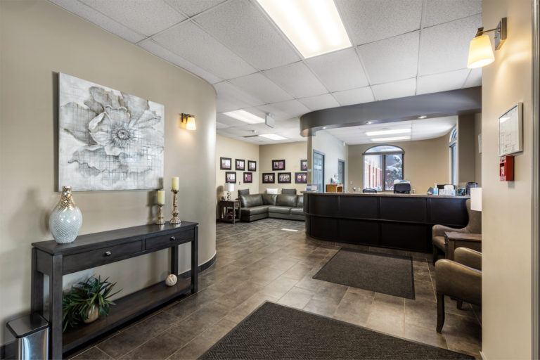 Oliver's Foyer, on site at Oliver's Funeral home. The entrance when you walk in, you will see a couple chairs as well as the reception desk and couches to sit on.