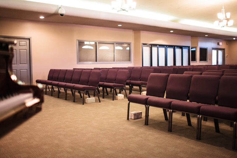 Chapel and Reception Hall on site at Oliver's Funeral Home. Rows of chairs in the reception hall.