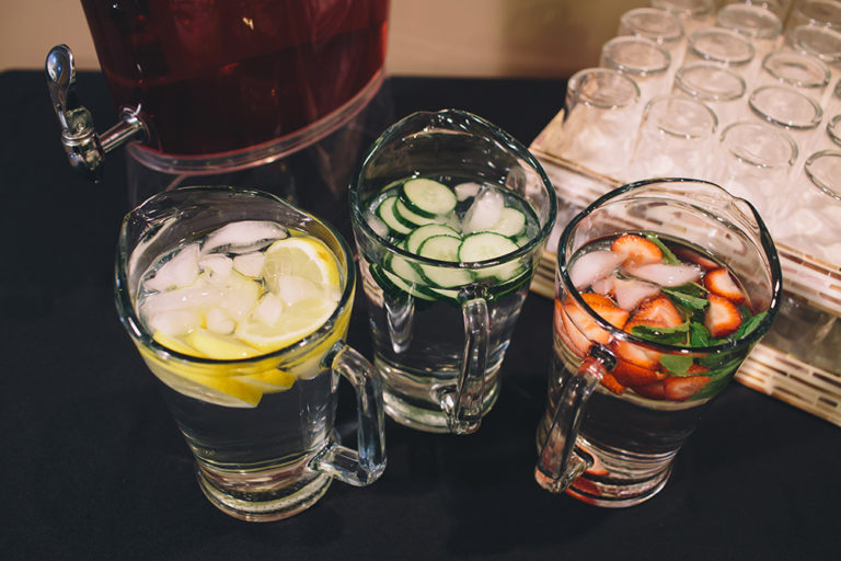 Catering on site at Oliver's Funeral Home. Water jug with lemons, water jug with cucumbers, and water jug with strawberries.