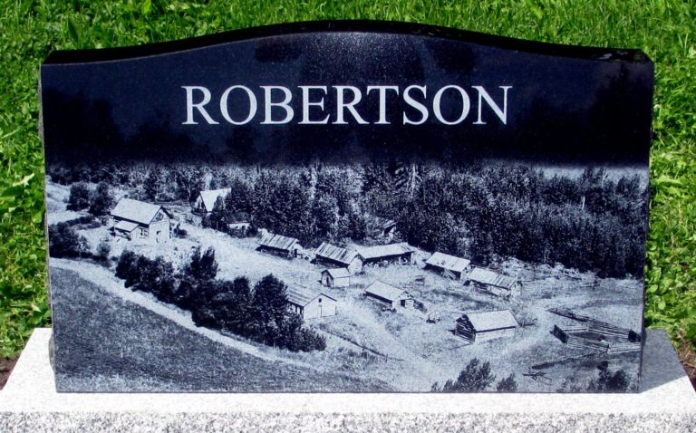 Granite Monument, the backside of a monument with the last name Robertson along with a photo of his homestead
