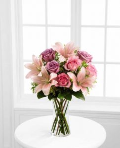 pink funeral flowers in a vase grande prairie