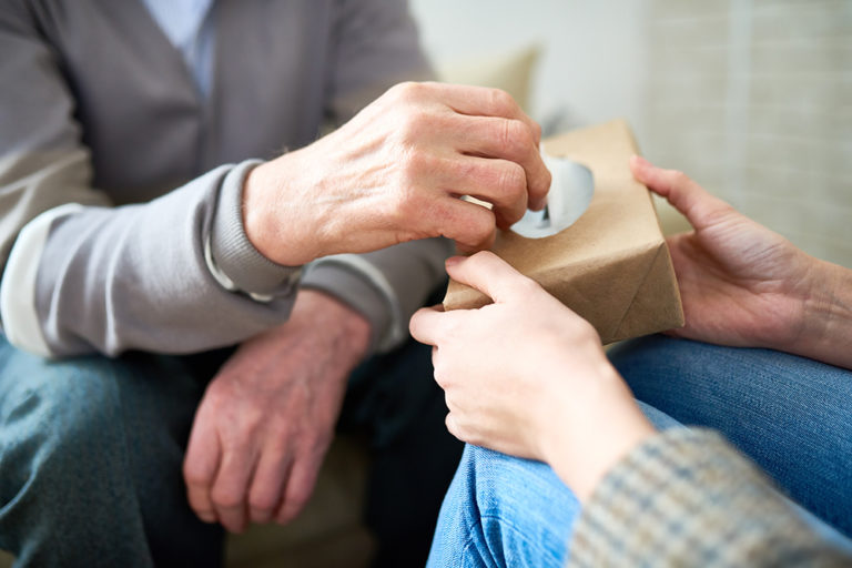 Psychiatrist Offering Tissues to Senior Patient