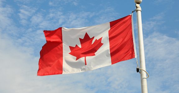 Canadian flag flying in the wind