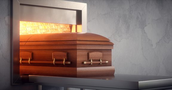 Coffin being cremated in a crematorium.